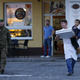 Image for article titled Photos: Hero Slovenian waiter delivers pizza to hungry migrant kids